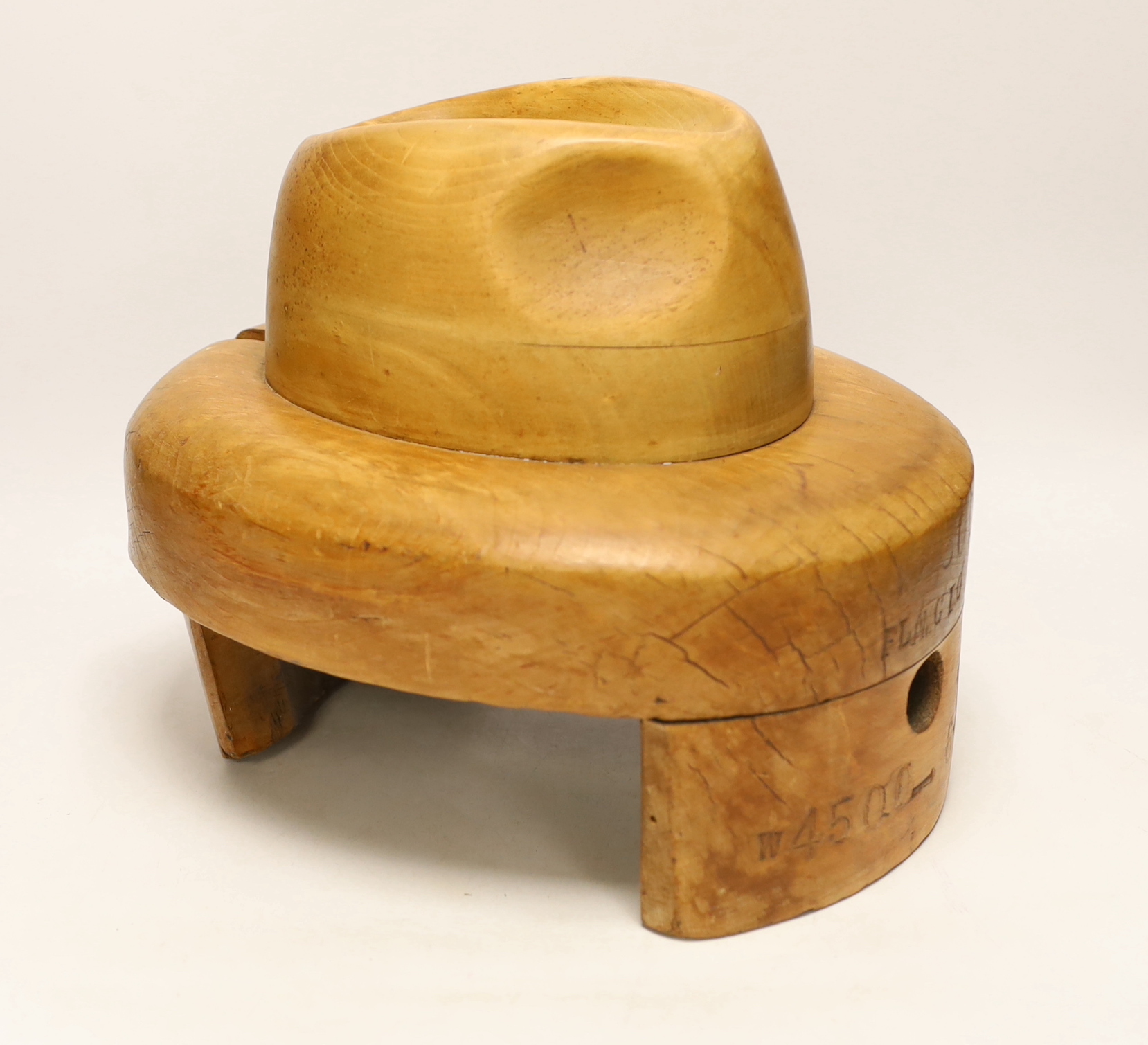 A stamped wooden hat last